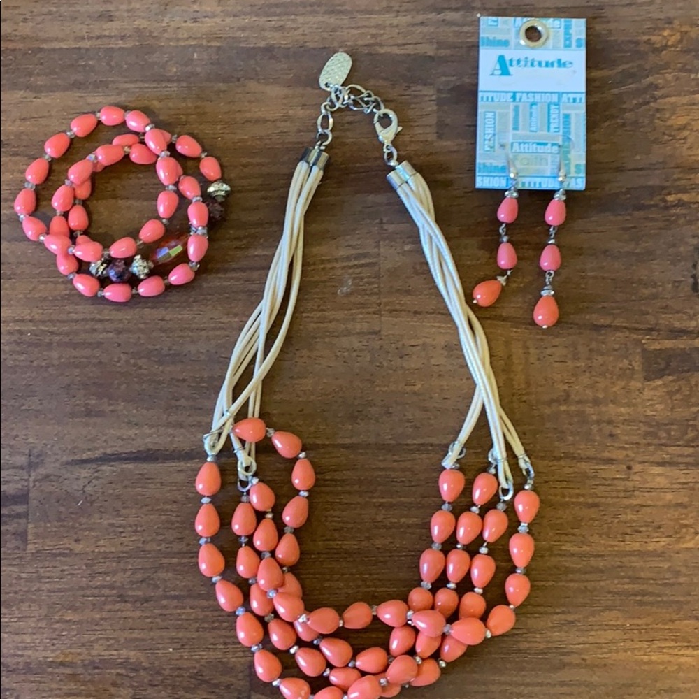 Coral necklace, bracelets, and earrings set.